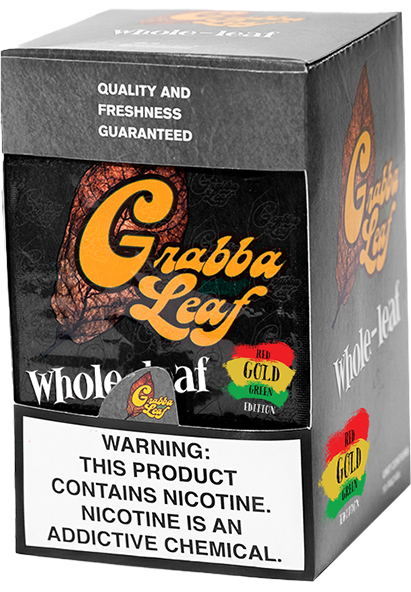 A deep brown, oil-rich Gold Edition whole grabba leaf with its black and gold pouch.